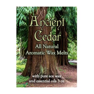 May include: A product label for "Ancient Cedar" aromatic wax melts. The label features a backdrop of large tree trunks and green foliage. Text on the label includes "All Natural Aromatic Wax Melts" and "with pure soy wax and essential oils 3 oz."