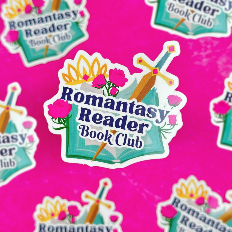 May include: A sticker with a blue book, a gold sword, pink flowers, and a gold crown. The text reads "Romantasy Reader Book Club".