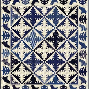 May include: A quilt with a blue and white geometric pattern. The quilt is made up of squares and diamonds, and the pattern is repeated throughout the quilt. The quilt is edged with a border of blue and white leaves.