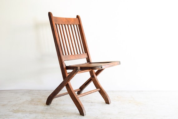 childs wooden chair with arms