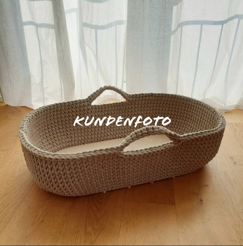 moses basket on floor