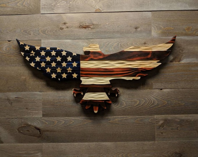 Carved wooden American flag eagle with unique chisel texture.