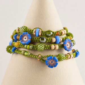 4 -Strand Macrame Wrapped Bracelet- (Periwinkle Flower Buttons- Chez Glass Beads- Horn Beads- Crystal Beads- Glass Beads)
