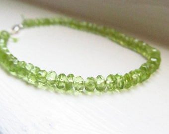 Peridot bracelet August birthstone green silk thread silver gold drape stacking