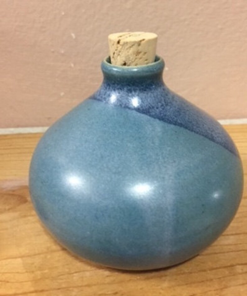 Download Charming Ceramic Bottle with Cork Stopper in Shades of ... Yellowimages Mockups