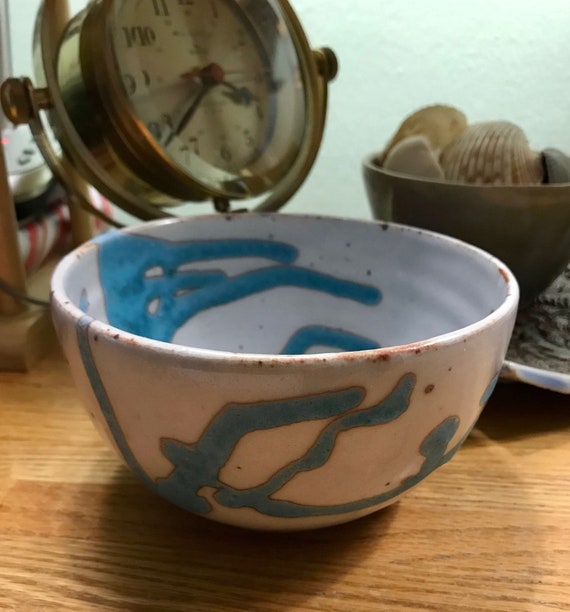 Ceramic Bowl with Rich Turquoise Swirling on a Background of White