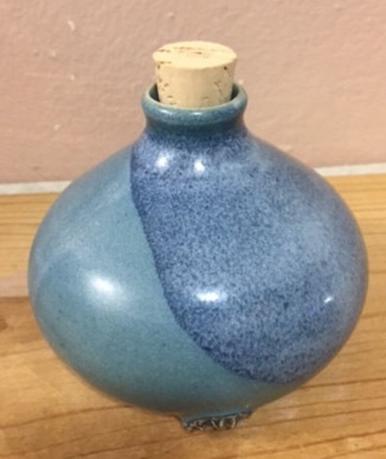 Download Charming Ceramic Bottle with Cork Stopper in Shades of ... Yellowimages Mockups