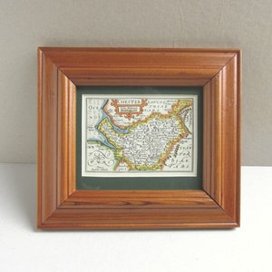 May include: A framed antique map of Chester, England, with a wooden frame and a green mount. The map is titled "Chester Lanc: Pal: and Cheshire" and shows the surrounding area.