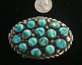 Sterling silver and turquoise belt buckle signed APACHITO