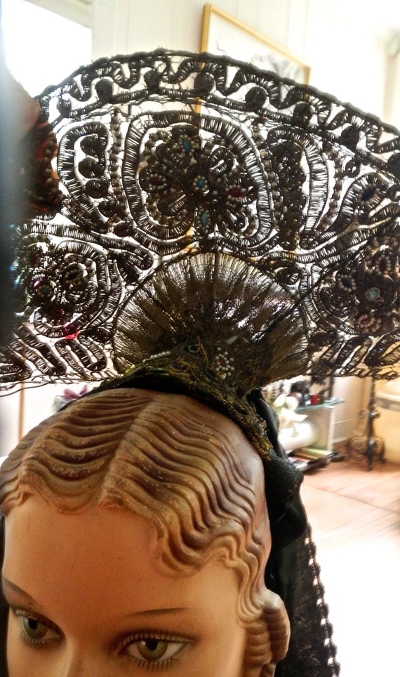 An 1800s hair adornment in metallic gold bouillon 
