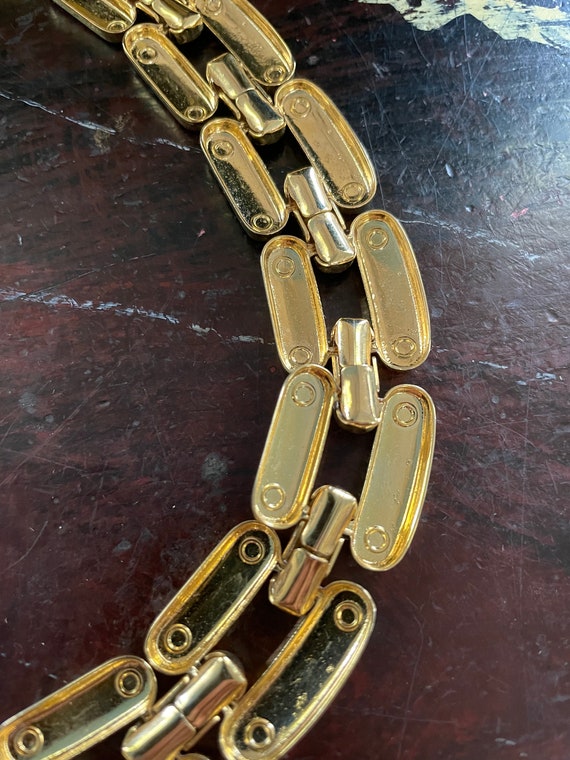 Gold chunky link chain circa 1980s,which lays at nape… Gem