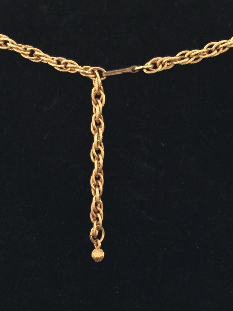A gold plated necklace from the 60s Mod in hammered metal,collar form