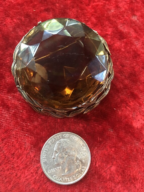Round amber glass topaz color  brooch circa 1960s 