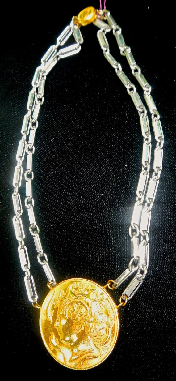 A Miriam Haskell coin necklace in silver chain and