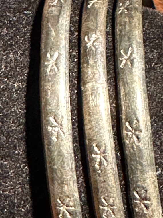 A set of  three incised sterling bangles ,made in… - image 3