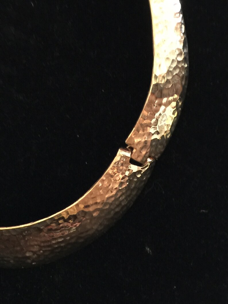A gold plated necklace from the 60s Mod in hammered metal,collar form