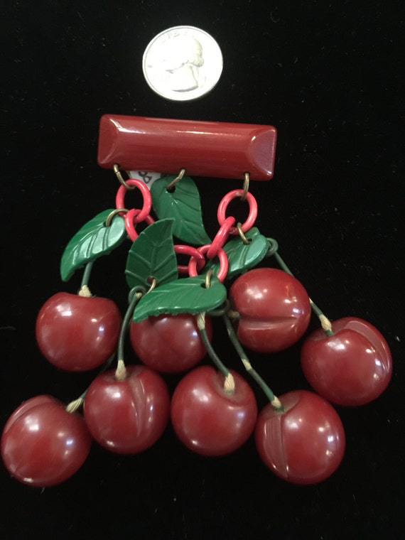 Bakelite and celluloid cherry pin circa1940s