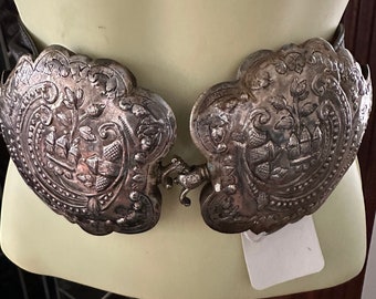 Silver metal, possibly over brass belt buckle,Middle Eastern in origin, circa 1940s