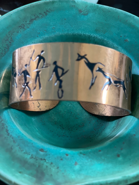 1960s copper cuff bracelet with African hunters an