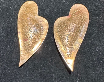 Late 1980s Brutalist,hand hammered and stamped asymmetrical heart or angel wing pierced earrings