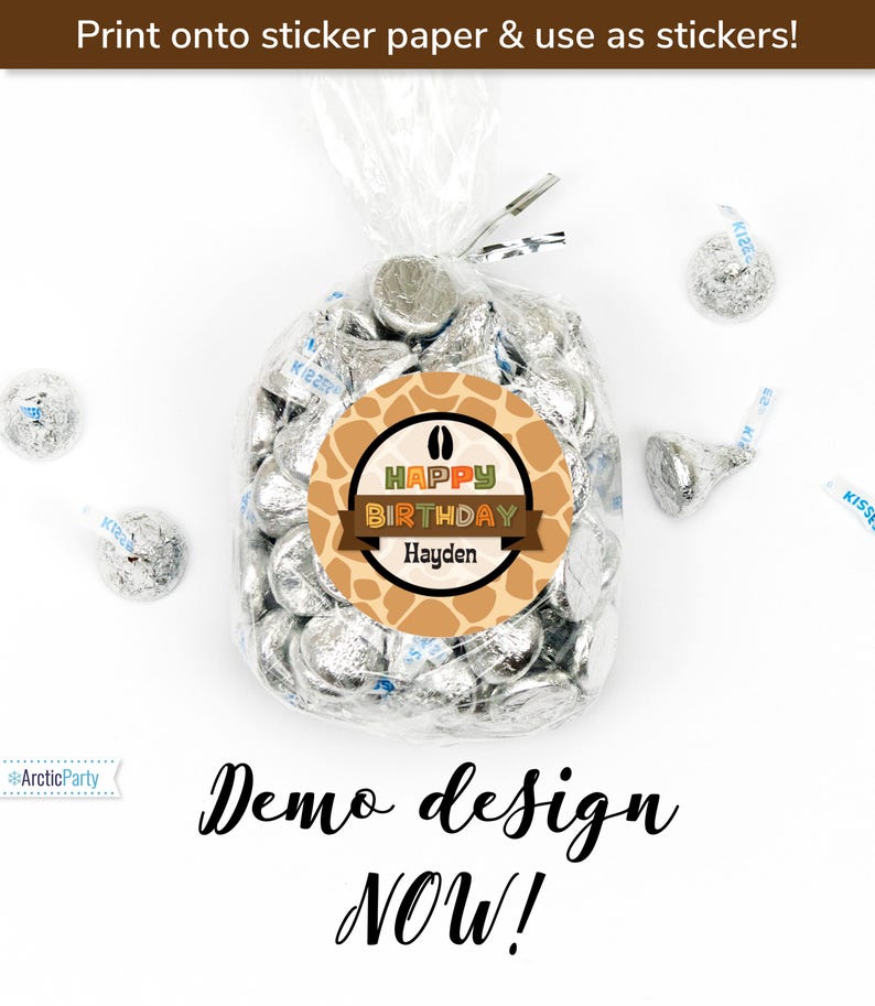 May include: A brown and orange giraffe print circle sticker with the text "Happy Birthday Hayden" in colorful letters. The sticker is on a clear plastic bag filled with silver foil-wrapped chocolate kisses.