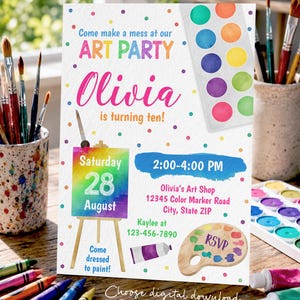May include: A white rectangular art party invitation card featuring colorful polka dots, a watercolor palette, an easel with a rainbow canvas, and a wooden paint palette. Text includes: Come make a mess at our ART PARTY, Olivia is turning ten!, Saturday 28 August, 2:00-4:00 PM, Olivia's Art Shop, 12345 Color Marker Road, City, State ZIP, Kaylee at 123-456-7890, Come dressed to paint!, RSVP, and Choose digital download or printed cards.