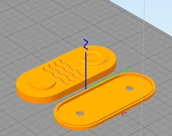 May include: Two orange plastic parts for a 3D printed object. The top part has a wavy design and a round hole. The bottom part has two round holes.