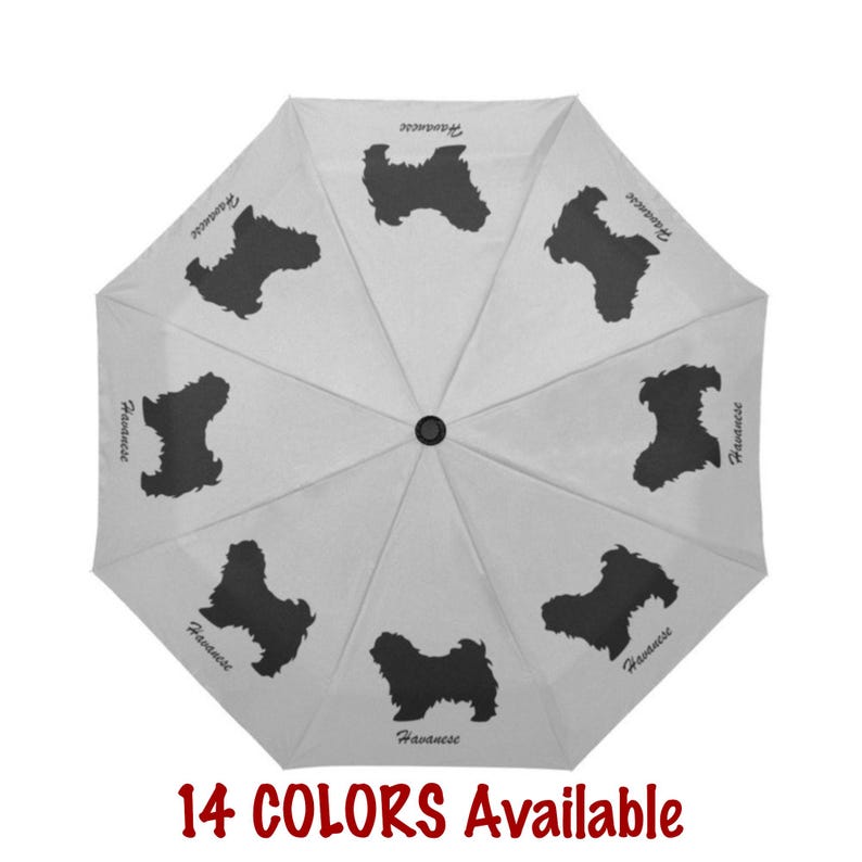 May include: A white umbrella featuring a repeating pattern of black Havanese dog silhouettes. The word "Havanese" is printed near each dog. The text "14 COLORS Available" is displayed in red at the bottom of the image.
