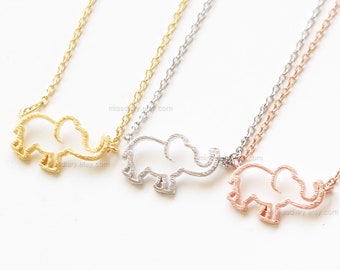 May include: Three delicate necklaces with elephant pendant charms. The necklaces are gold, silver, and rose gold.