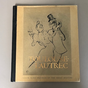 May include: A book titled "Toulouse-Lautrec" with a black spine and a tan cover. The cover features a gold illustration of a dancing couple and gold lettering. The text "COLOR SLIDE PROGRAM OF THE GREAT MASTERS" is at the bottom.