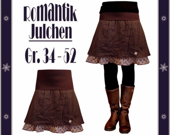 May include: A brown skirt with a ruffled hem and a brown waistband. The skirt is layered with a patterned fabric underneath. The text "Romantik Julchen Gr. 34-52" is printed on a white background.