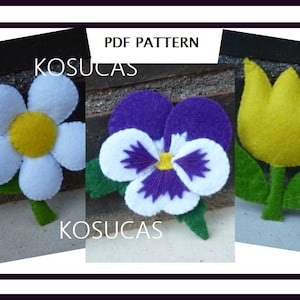 Puede incluir: Patrón PDF para manualidades de flores de fieltro. La imagen muestra tres flores de fieltro: una margarita blanca, una violeta morada y un tulipán amarillo. Cada flor tiene hojas de fieltro verde.