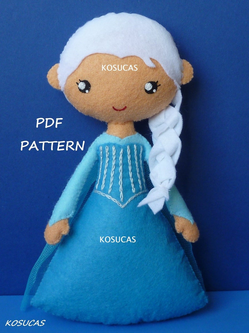 May include: A felt doll pattern for a princess with a white braid, blue dress, and a white crown. The pattern is available as a PDF download. The text "PDF PATTERN" is visible on the image.