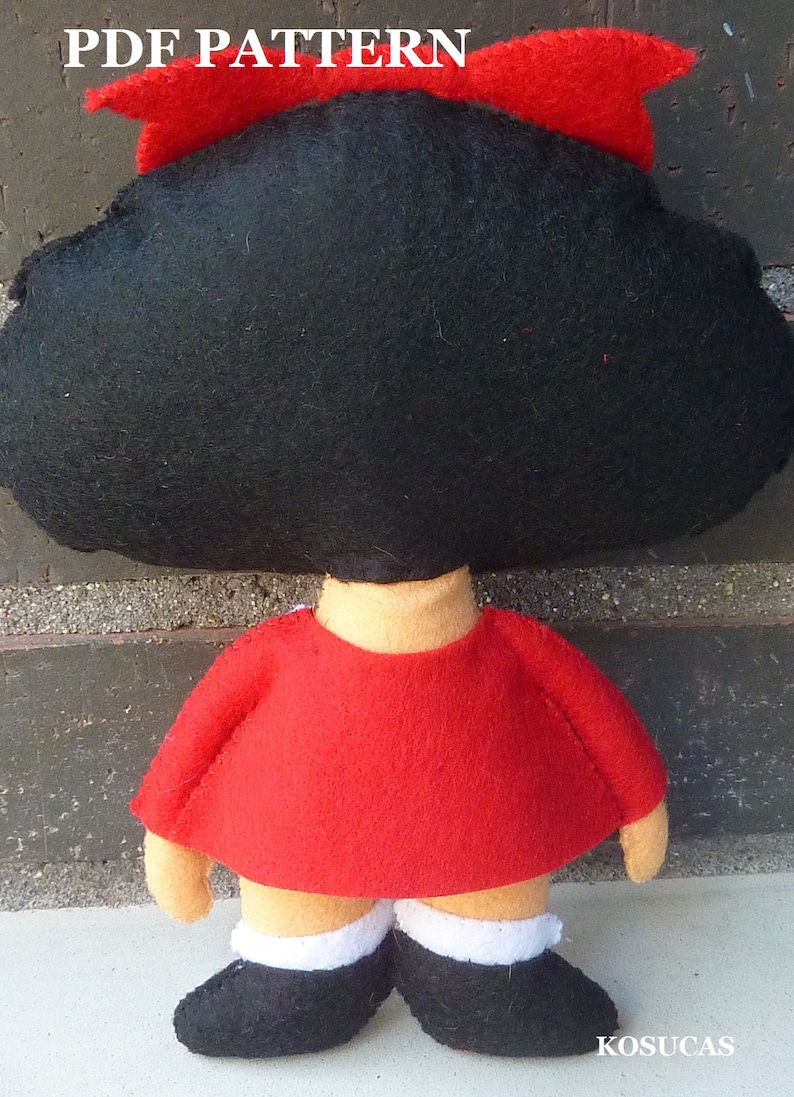May include: A felt doll pattern for a girl with black hair and a red dress. The pattern includes instructions for making the doll's hair, dress, and shoes.