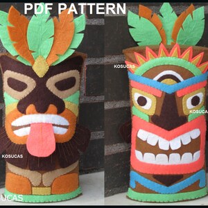 May include: Two felt tiki god figures with colorful details. The figures are brown with orange, yellow, green, blue, and white accents. The figures have smiling faces with teeth and tongues.