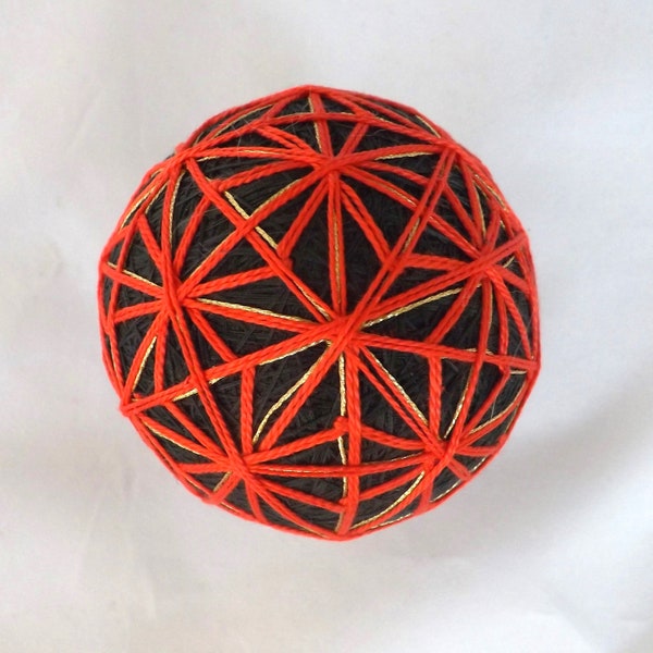 Japanese Temari Ball handmade rice hulls with bell,handmade by me neon Red design forming twelve stars over Black