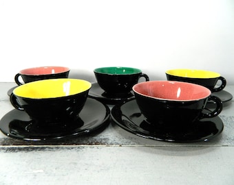 Set of 5 demitasses cups and saucers.