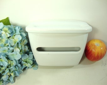 Ceramic toilet paper dispenser with ashtray