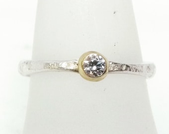 0.1 Carat Diamond solitaire ring in 14 ct gold and reticulated silver