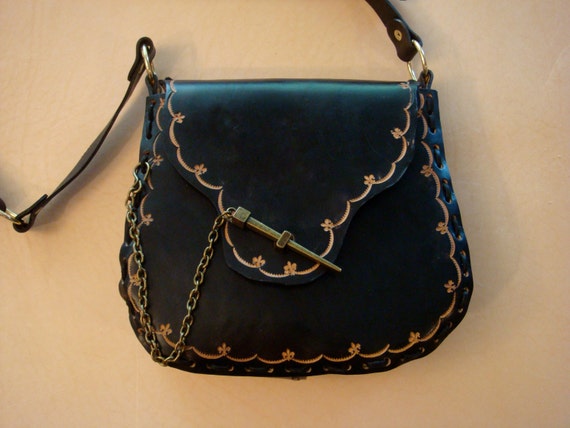 black tooled leather bag
