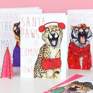 Carte de Noël guépard chats chanteurs « pattes du père Noël »
