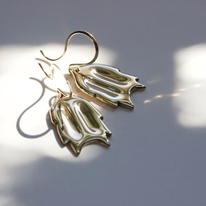 christmas cactus earrings on white background with dappled sunlight. 
made by l.greenwalt jewelry in Portland Oregon.