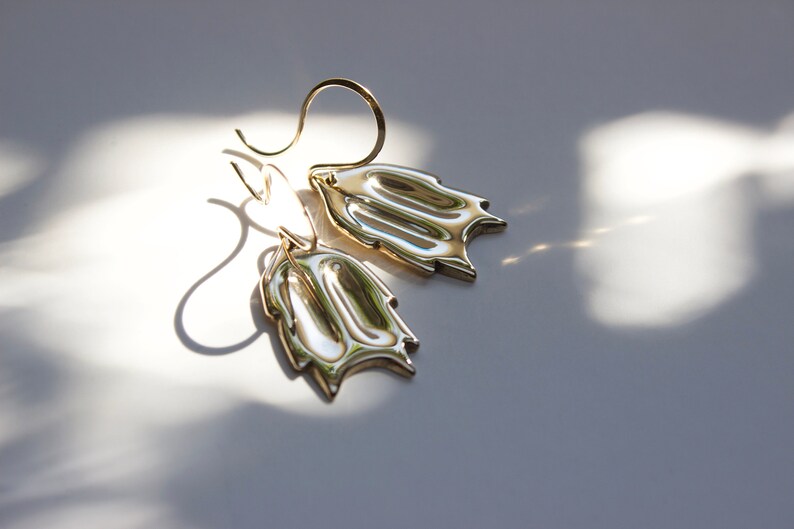 christmas cactus earrings on white background with dappled sunlight. 
made by l.greenwalt jewelry in Portland Oregon.