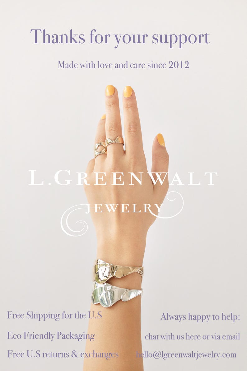 May include: A hand wearing gold and silver jewelry, including rings and bracelets. The image features the text "Thanks for your support" and "Made with love and care since 2012". The brand name "L. GREENWALT JEWELRY" is also visible.