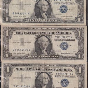 1957  Lot of Three (3) U.S. One Dollar Silver Certificates in Crisp VF to EF Condition.