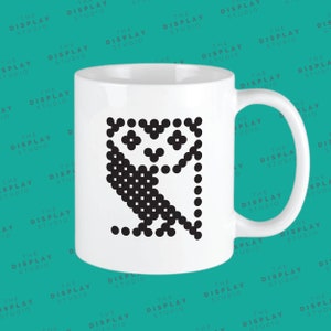 May include: White ceramic mug featuring a black pixelated owl design. The mug has a handle on the right side.