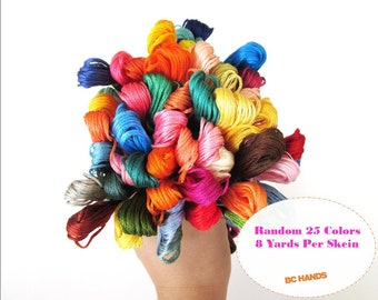 May include: A collection of 25 skeins of embroidery floss in a variety of colors. Each skein is 8 yards long. The text "Random 25 Colors 8 Yards Per Skein" and "BC HANDS" is visible on the image.