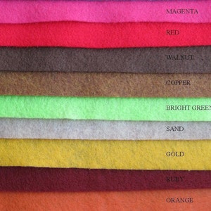May include: A color palette of felt fabric swatches in various shades, including magenta, red, walnut, copper, bright green, sand, gold, ruby, and orange. Each color is labeled with its name in white text.