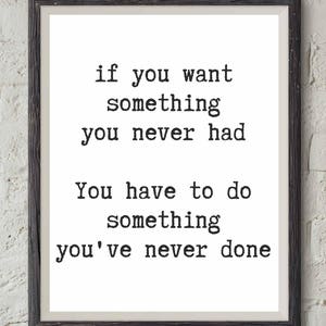 May include: Black and white framed print with a motivational quote: "if you want something you never had You have to do something you've never done"
