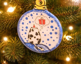 Cat with hat dreaming of a  present ornament